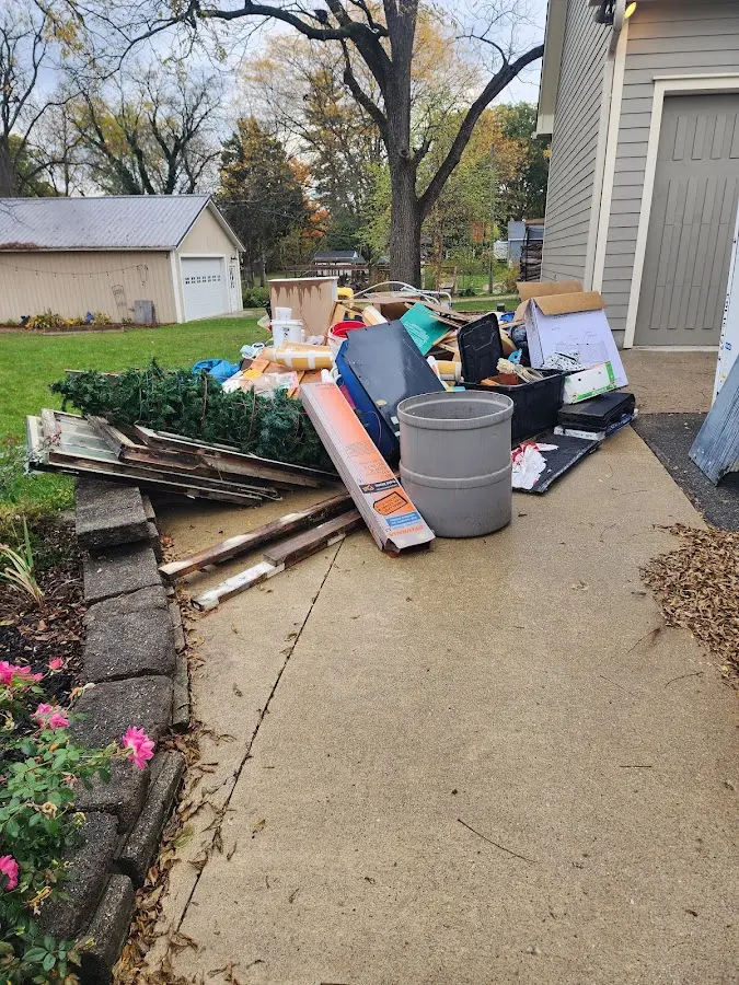 Dumpster being loaded with debris for Roofing Dumpster Rental in Exeter